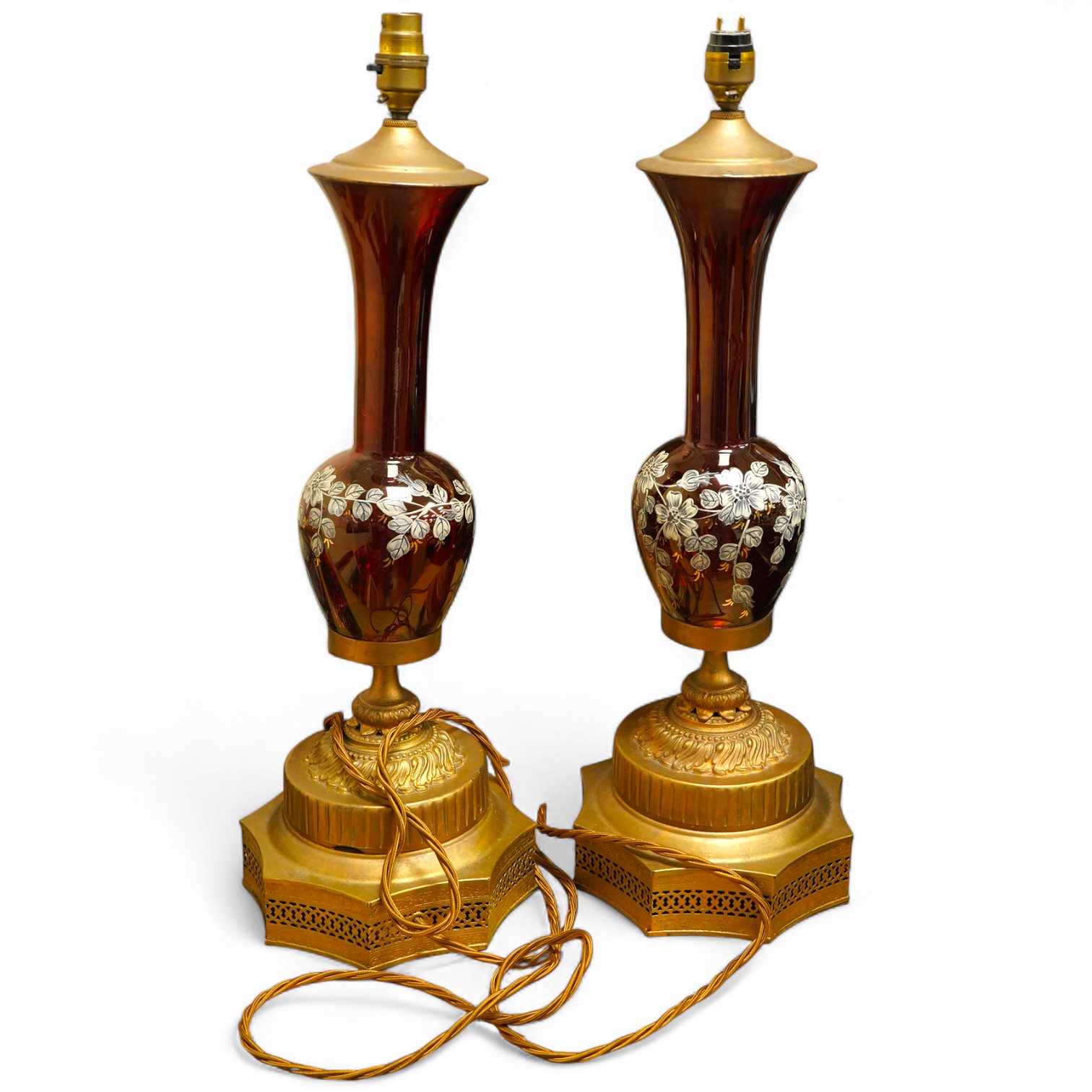 A pair of ruby glass, enamel and gilt metal table lamps, 57cm